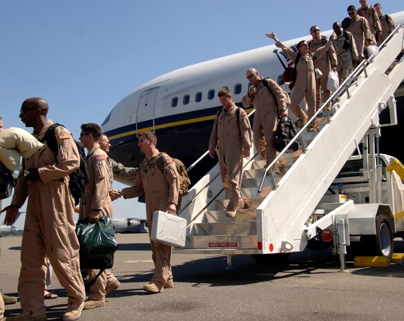 Airmen from the 14th Airlift Squadron arrive on the Charleston AFB flightline Sept. 3 after a four-month deployment to Southwest Asia. More than 30,000 Airmen are deployed around the world in support of various Air Force missions including Operations Iraqi and Enduring Freedom.  (U.S. Air Force photo/Airman 1st Class Cynthia Spalding)