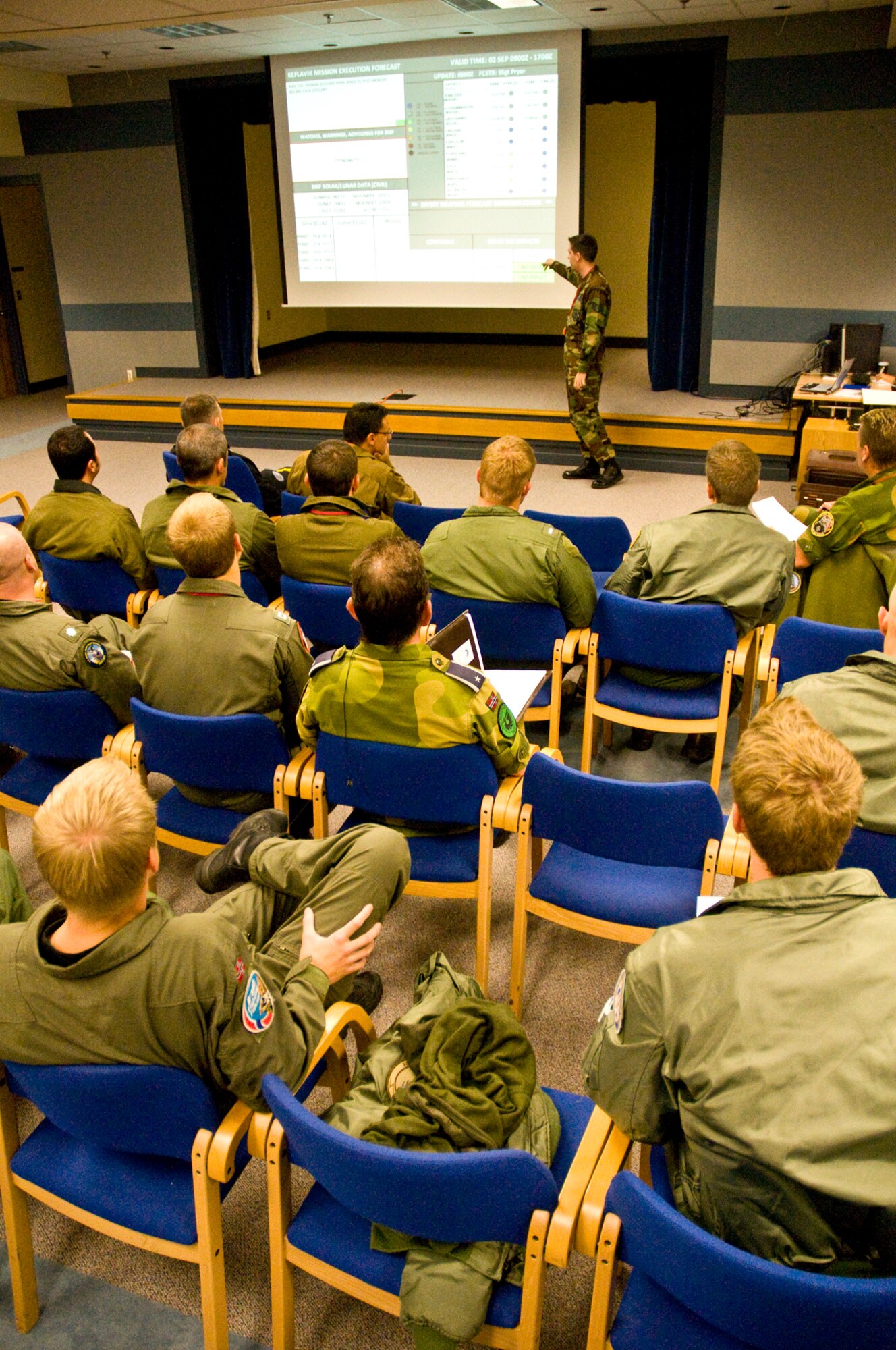 KEFLAVIK AIRPORT, Iceland - Staff Sgt. Cody Pryer, a weather forecaster here deployed from the 48th Operations Support Squadron at RAF Lakenheath, England, briefs pilots from the U.S., Norway, Denmark, Canada and NATO with weather information prior to their flights. He briefs information such as wave heights, for search and rescue reasons, cloud heights for refueling purposes and turbulence and thunderstorm information. The forces here are participating in the 2008 Northern Viking multinational exercise which is designed to hone the skills necessary to assist Iceland in its defense. (U.S. Air Force photo by Staff Sgt. Nathan Gallahan.)