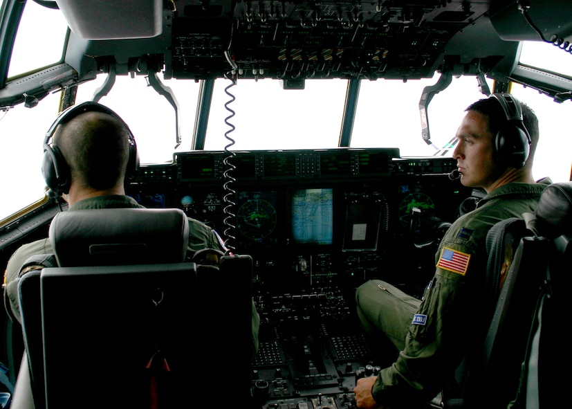 C-130-J copilot, Capt. James Glasscock coordinates with pilot, Lt. Col. Kevin McCluen as he prepares to turn into the eye of Hurricane Gustav during a mission to penetrate the storm Mon. Sept. 1, 2008.
Air Force photo by Senior Master Sgt. Raymond Sarracino
