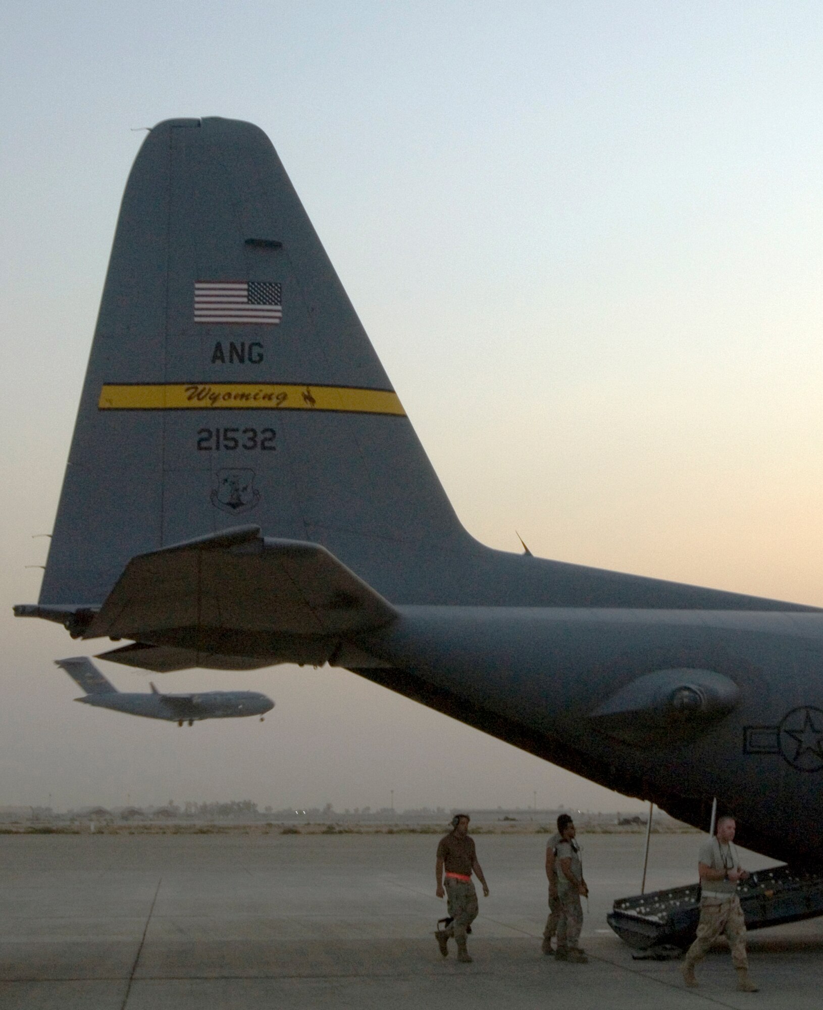 JOINT BASE BALAD, Iraq -- A C-130 Hercules aircrew prepares the aircraft for an airlift mission here Sept. 2. The crew, assigned to the 777th Expeditionary Airlift Squadron here, completed the squadron's 25,000th combat sortie, which carried approximately 25 passengers and 64,000 pounds of equipment between Baghdad International Airport and Al-Asad Air Base. The aircrew is deployed from Little Rock Air Force Base, Ark. The aircraft is deployed from the Wyoming Air National Guard's 153rd Airlift Wing. (U.S. Air Force photo/Tech Sgt. Erik Gudmundson)