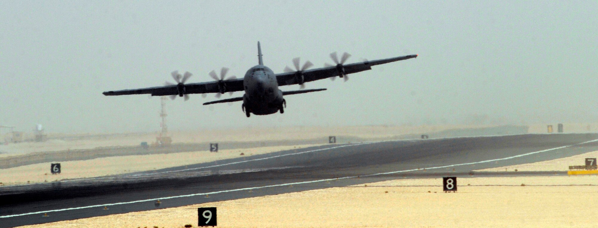 A C-130 Hercules from Youngstown Air Reserve Station, Ohio, fights a cross wind as it starts a mission from an undisclosed air base in Southwest Asia Sep. 2, 2008.  The sand, heat, and wind are all obstacles to be overcome during this deployment.  The C-130 Hercules primarily performs the tactical portion of the airlift mission. The aircraft is capable of operating from rough, dirt strips and is the prime transport for air dropping troops and equipment into hostile areas. The C-130 operates throughout the U.S. Air Force and is here in support of Operations Iraqi and Enduring Freedom and Joint Task Force-Horn of Africa.  (U.S. Air Force photo by Tech. Sgt. Michael Boquette/Released)