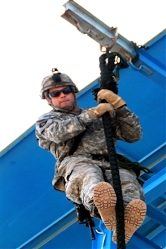 A U.S. Army soldier descends a fast roping drill during a tower training exercise on Forward Operating Base Fenty, Jalalabad, Afghanistan, Aug. 29, 2008. The soldier is assigned to the Pathfinder Detachment Task Force Out Front. 