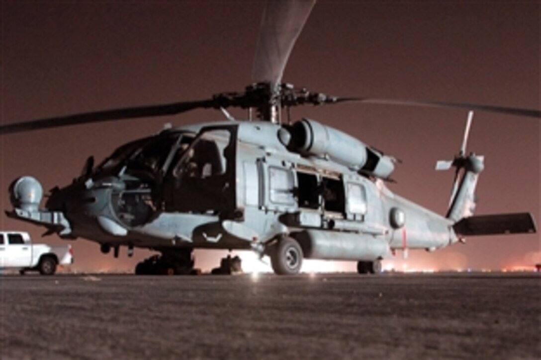 Members of Combined Joint Special Operations Air Component, CJSOAC , from Helicopter Sea Combat Squadron 84, conduct night operations, Balad, Iraq, Aug. 25, 2008. The squadron is the only Navy component of the CJSOAC and has been supporting vital special operations missions in the Iraqi theatre. 