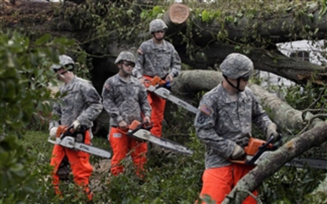 U.S. Army soldiers return to clear roads after evacuating the residents of Houma, La., on Sept. 3, 2008.  The soldiers are assigned to the 1st Platoon, 843rd Engineer Company, 205th Engineer Battalion, 225th Engineer Brigade, Louisiana National Guard.  