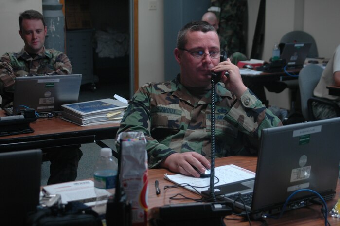 Tech. Sgt. Timothy Dermody coordinates base security during Tropical Storm Hanna from the Emergency Operations Center at Charleston AFB Sept. 5. Charleston AFB evacuated 11 C-17s to Whiteman AFB, Mo., and Wright-Patterson AFB, Ohio, in preparation for the storm. Sergeant Dermody is the NCO in charge of security forces training with the 437th Security Forces Squadron. (U.S. Air Force photo/Staff Sgt. Sam Hymas)