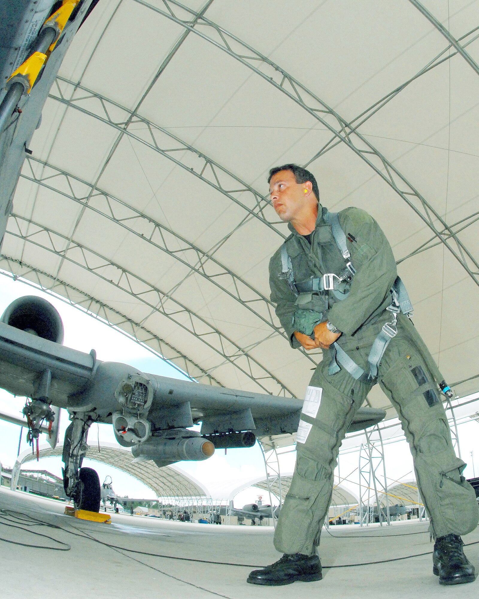 Lt. Col. Mickey Moore, a pilot with the 442nd Fighter Wing, Detachment 1, prepares to climb into the cockpit an A-10 Thunderbolt II for a training mission at Moody Air Force Base, Ga. Colonel Moore is one of several Air Force reservists at Moody laying the groundwork for an Air Force Reserve Command A-10 associate fighter group that will be teamed up with Moody's active-duty 23rd FG. The 23rd FG's parent organization, the 23rd Wing, traces its Air Force roots to the legendary Flying Tigers of World War II. Detachment 1 will become the 476th FG and it will share that lineage. The detachment is a geographically separated unit of the 442nd FW, an AFRC A-10 wing at Whiteman AFB, Mo.(US Air Force photo/Master Sgt. Bill Huntington)