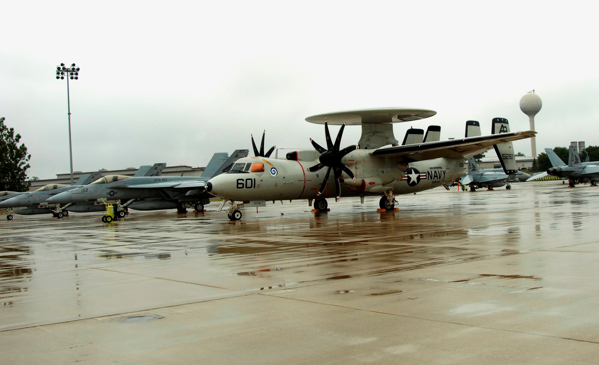 A U.S. Navy E-2 Hawkeye from Naval Air Station Norfolk is flanked by F-18s from NAS Oceana after flying from their home stations on the Virginia coast to Wright-Patterson Air Force Base, Ohio.  By Friday afternoon, Sept. 5, Wright-Patt had received 108 aircraft from six bases seeking safe haven from the approaching Tropical Storm Hanna. (U.S. Air Force photo/Al Bright)
