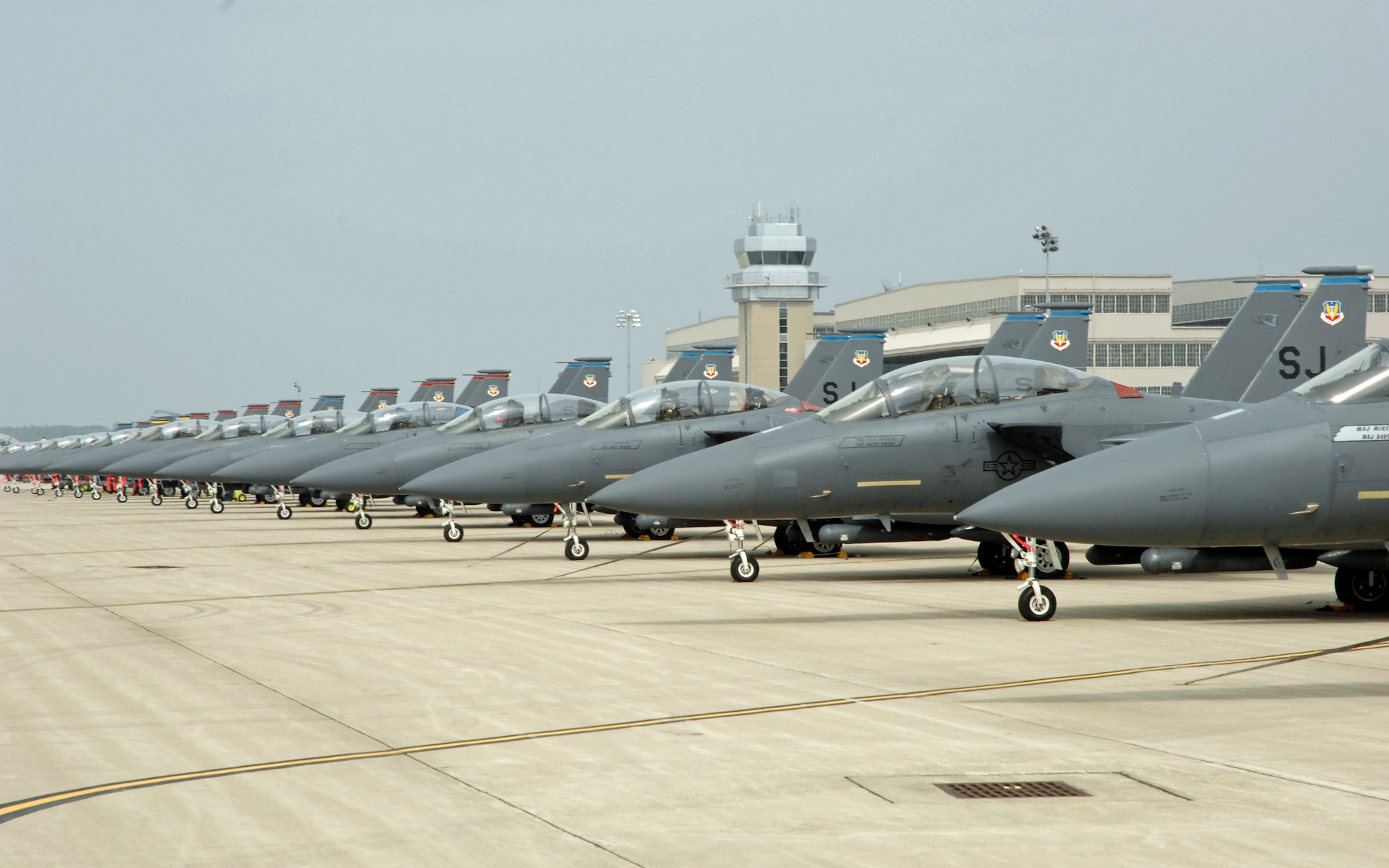 Some of the 75 F-15E Strike Eagles deployed from the 4th Fighter Wing, Seymour Johnson Air Force Base, N.C. are parked on the vast parking ramp at Wright-Patterson AFB, Ohio. By Friday afternoon, Sept. 5, more than 100 Air Force, Navy and Marine Corps aircraft sought safe haven at Wright-Patt from the approaching Tropical Storm Hanna. (U.S. Air Force photo/Al Bright)