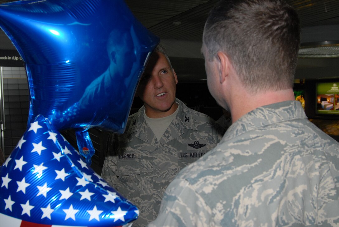 Chaplain Howard Bell, from the 932nd Airlift Wing at Scott Air Force Base, Air Force Reserve Command, is welcomed back to America by his commander, Col. John Flournoy, Jr. He was deployed to Afghanistan in support of Operation Enduring Freedom. U.S. Air Force by Maj. Stan Paregien