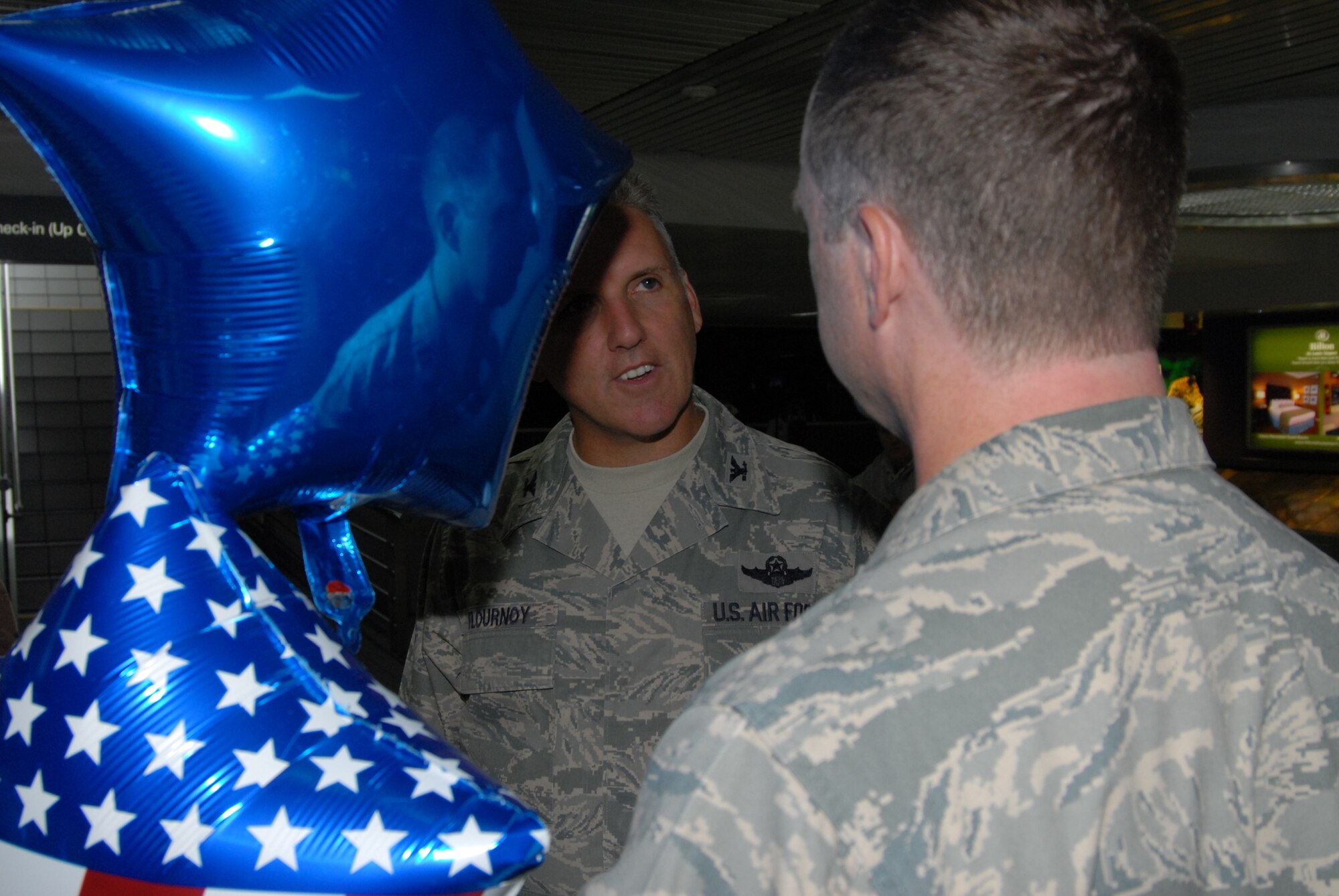 Chaplain Howard Bell, from the 932nd Airlift Wing at Scott Air Force Base, Air Force Reserve Command, is welcomed back to America by his commander, Col. John Flournoy, Jr. He was deployed to Afghanistan in support of Operation Enduring Freedom. U.S. Air Force by Maj. Stan Paregien