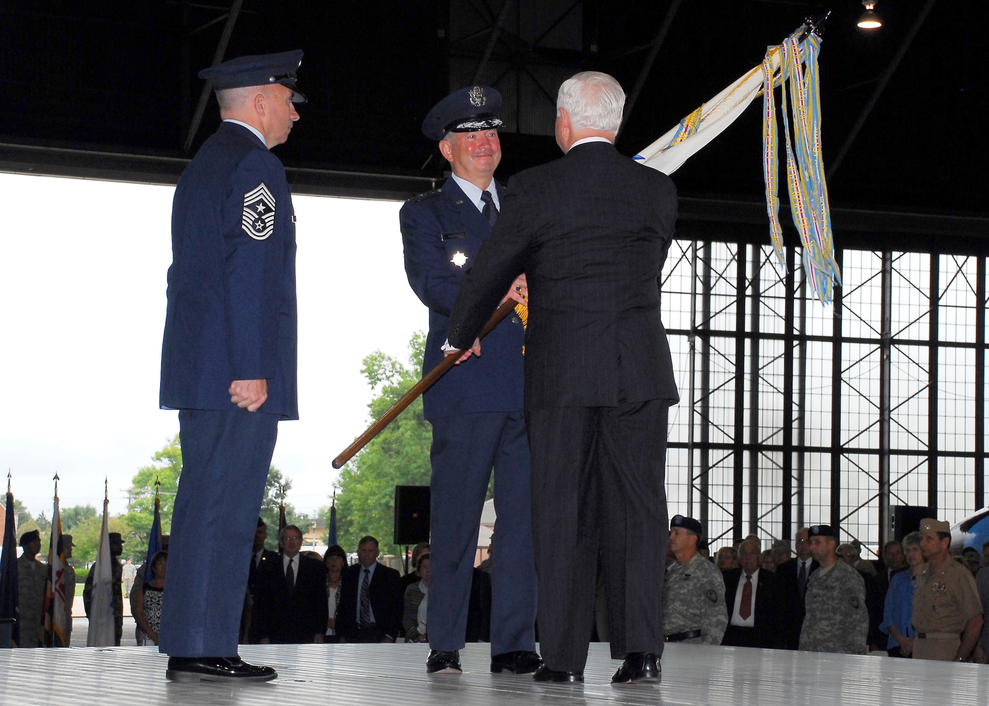 Gen. Duncan J. McNabb accepts the U.S. Transportation Command flag from Secretary of  Defense Robert M. Gates Sept. 5, during an assumption of command ceremony at Scott Air Force Base, Ill.  At left is Chief Master Sgt. Kenneth L. McQuiston, USTRANSCOM command chief master sergeant, who first presented the flag to Secretary Gates. (U.S. Air Force photo/Bob Fehringer)
