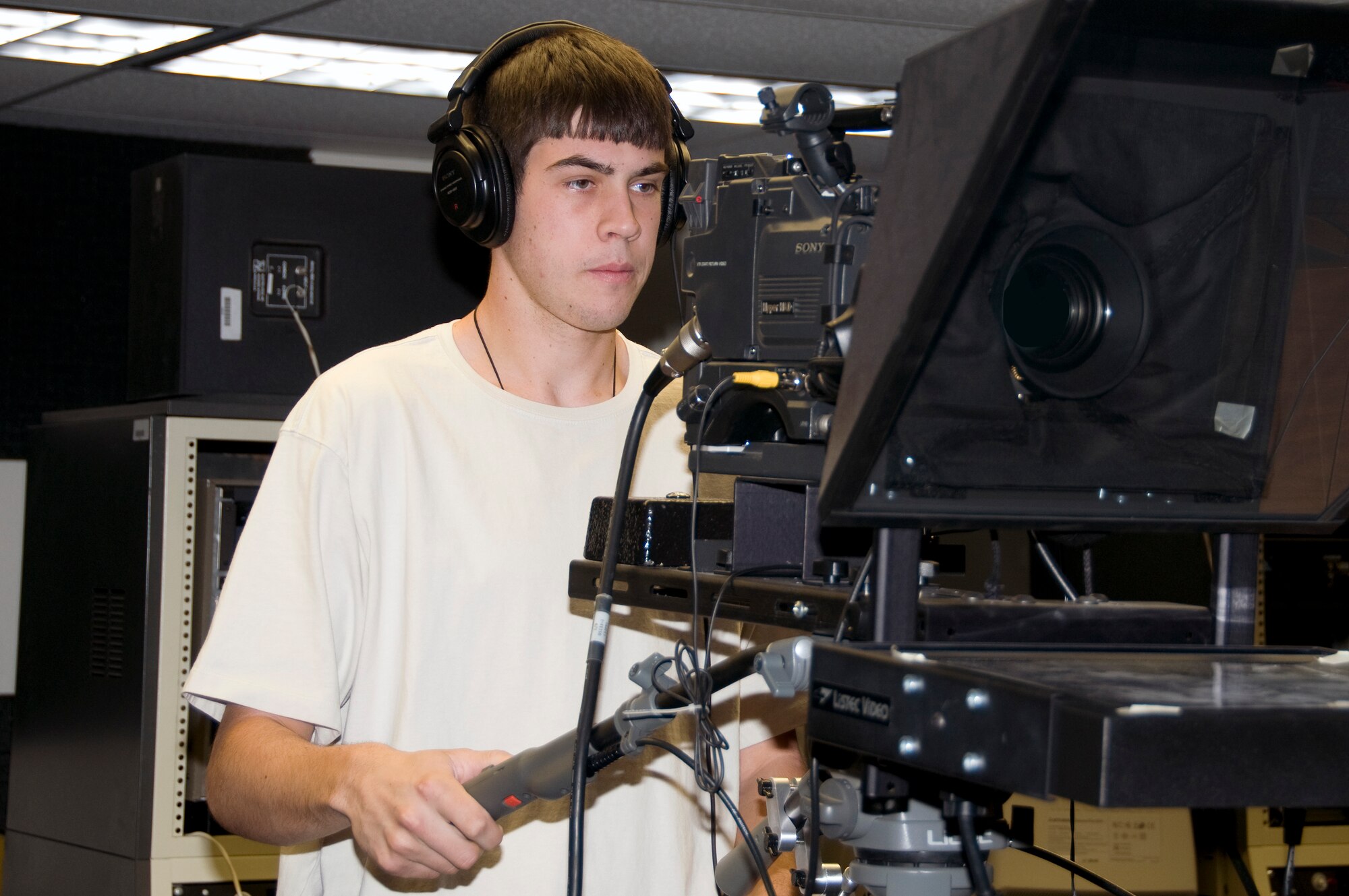 Ethan Halliday operates the camera during a filming session as part of his duties as a student intern with the Air Force Operational Test and Evaluation Center. The program partners AFOTEC with the University of New Mexico to recruit students and expose them to government service, particularly in shortage career fields.