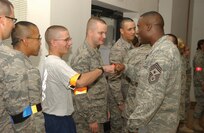 Air Force basic trainees get words of encouragement from Chief Master Sgt. Juan Lewis, 37th Training Wing command chief, during the Mentoring Eats and Leadership event Aug. 25. (USAF photo by Alan Boedeker)                               
