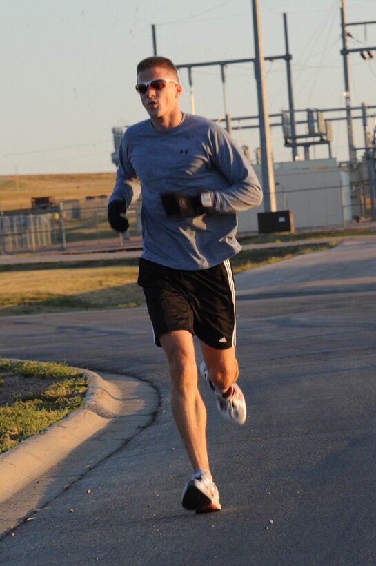Capt. Edward Rozak, 28th Operations Support Squadron weather flight commander, runs in the Labor Day 5K run here, Sept. 5. Out of forty participants, Captain Rozak won the event with a time of 19 minutes, 29 seconds. (U.S. Air Force photo/Airman 1st Class Adam Grant)

