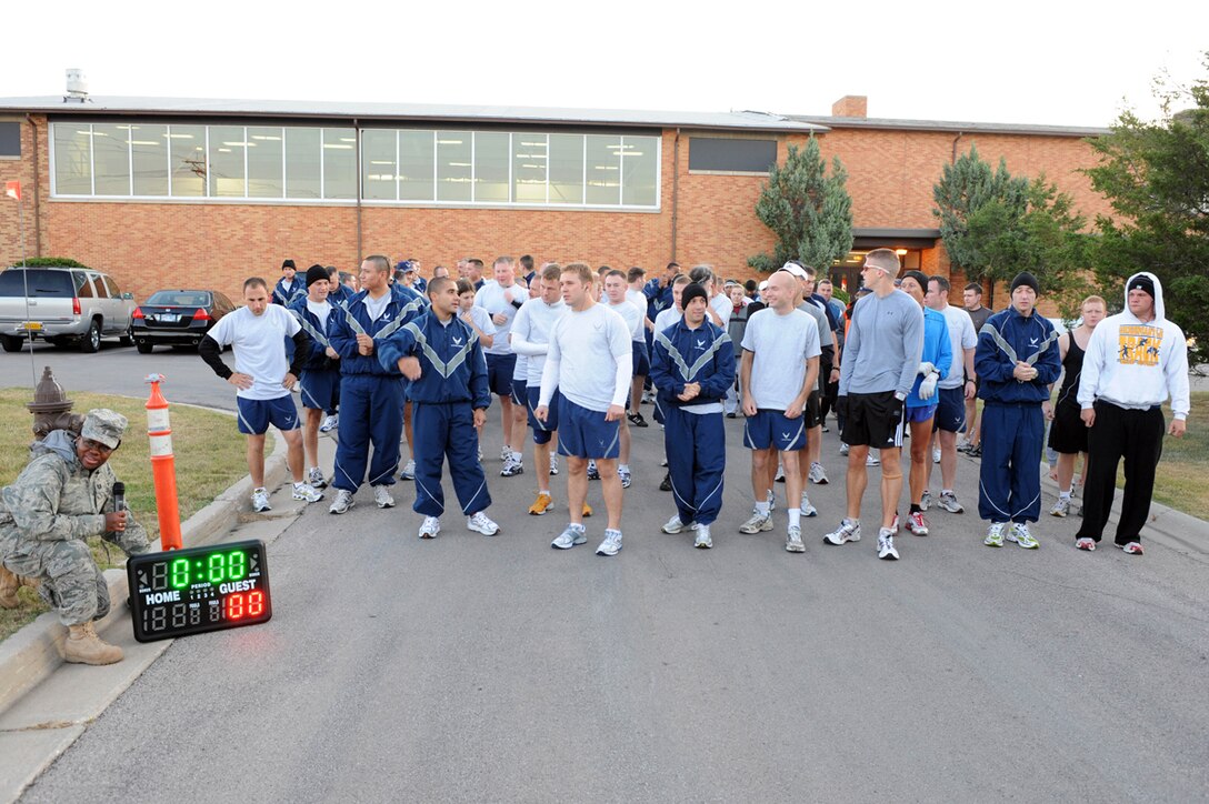 Airmen await the start of the Labor Day 5K run here, Sept. 5. The run organized by the Bellamy Fitness Center staff, provided an opportunity for Airmen on base to participate in fitness as a community. (U.S. Air Force photo/Airman 1st Class Adam Grant)
