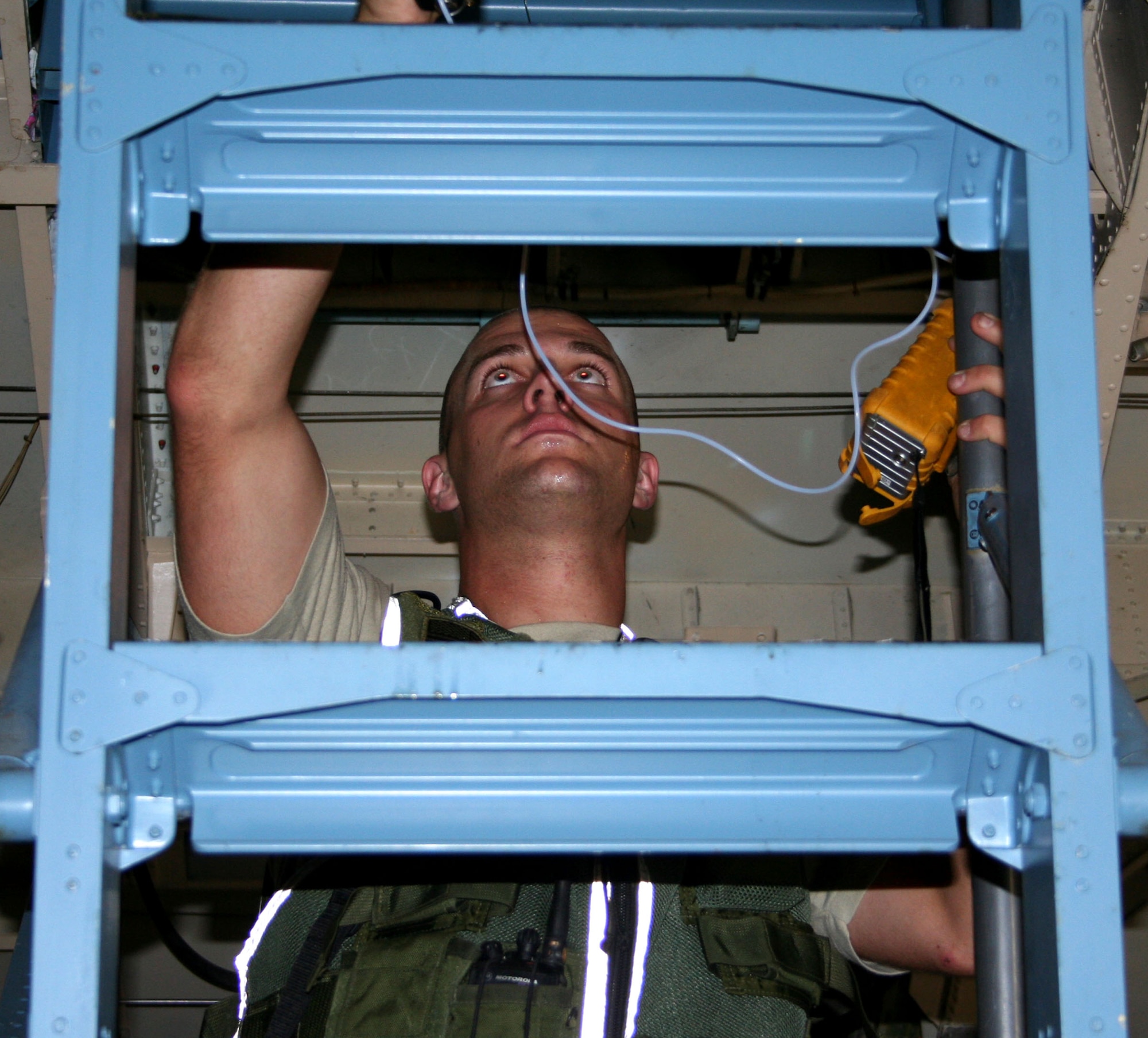WRIGHT-PATTERSON AFB, Ohio - Ohio Air National Guard Staff Sgt. Gabe Taylor, 52nd Weapons of Mass Destruction Civil Support Team, inspects a 445th Airlift Wing C-5 Galaxy for radiological isotopes as part of a multi-day, joint exercise with the Indiana National Guard’s 53rd WMD Civil Support Team, Ohio Task Force 1, the Dayton Fire Department, the Kettering Fire Department and the FBI.  A portion of the exercise took place on the 445th Airlift Wing’s flightline at Wright-Patterson Air Force Base, Ohio, Sept. 4, 2008.  (U.S. Air Force photo/Capt. Caroline Wellman)