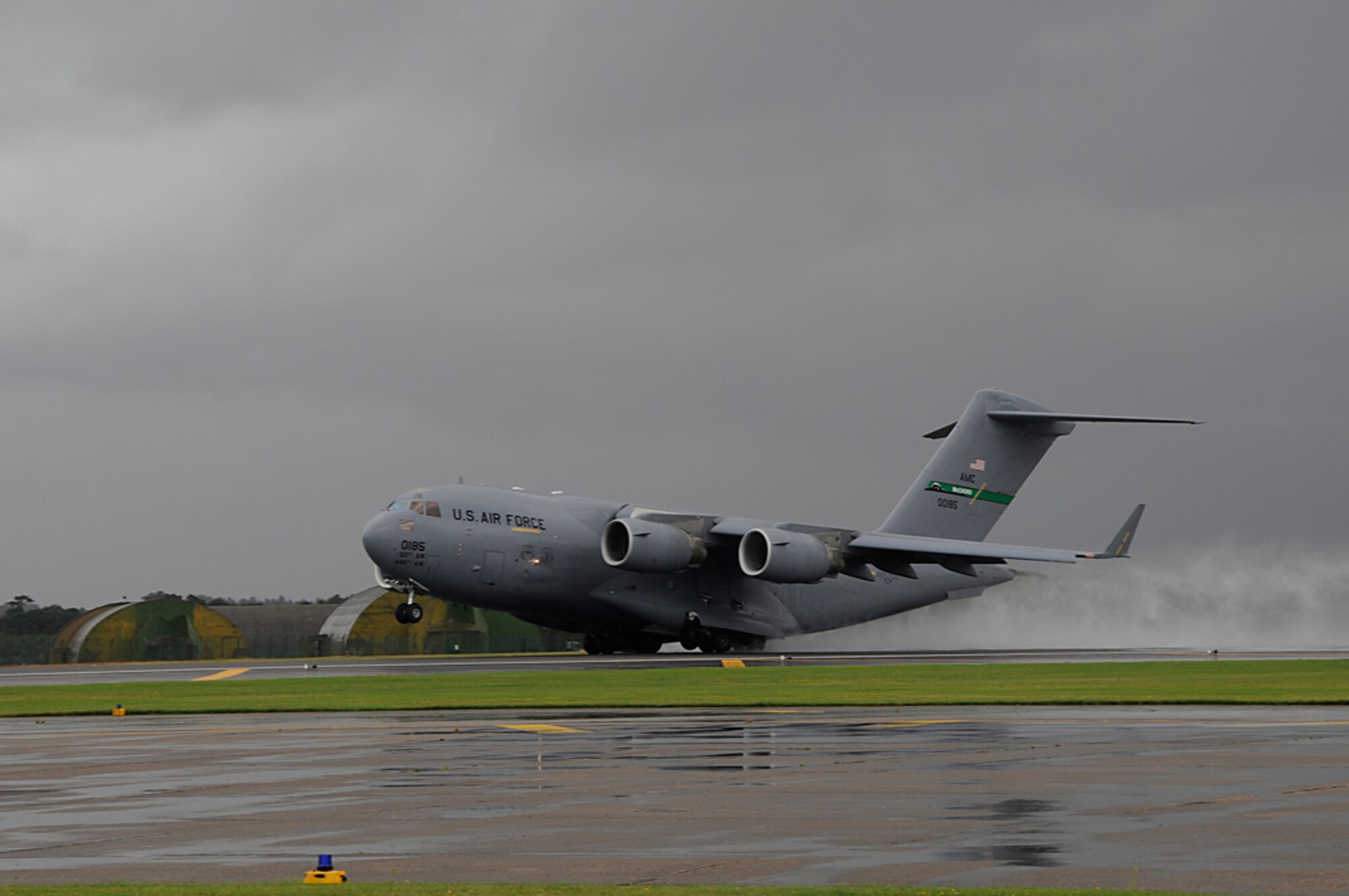A C-17 takes off from RAF Lakenheath, England on its way back to McChord AFB, Wash. after stopping overnight for rest and fuel. Throughout the month C-17's will land at RAF Lakenheath dropping off Airmen and cargo in support of AEF. (U.S. Air Force photo by Senior Airman Brian J. Ellis)