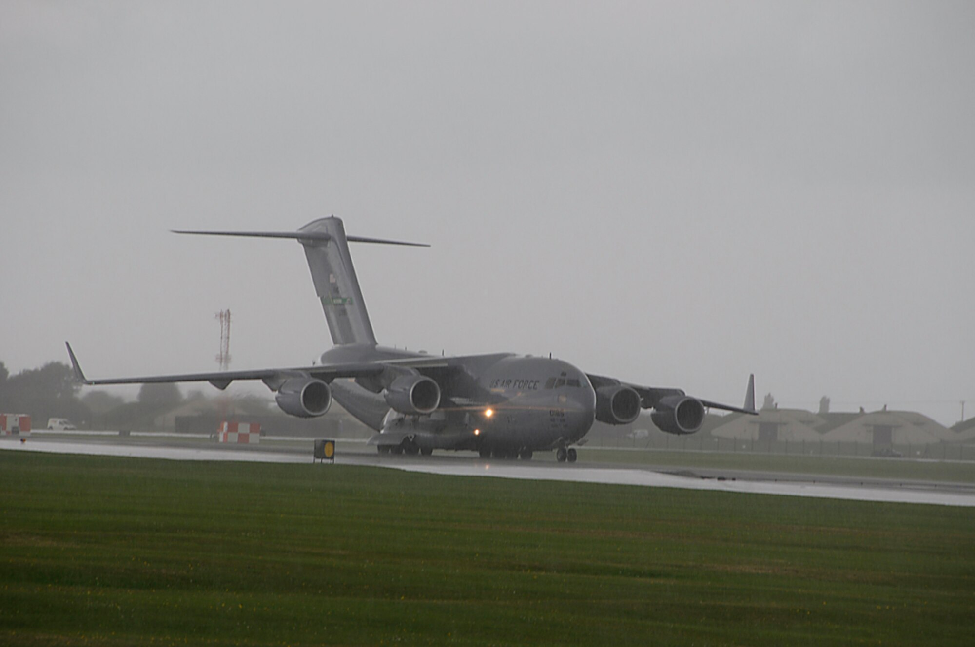 A C-17 taxies down the runway at RAF Lakenheath, England on its way back to McChord AFB, Wash. after stopping overnight for rest and fuel. C-17's are often used to bring back Airmen and supplies in support of different missions for AEF. (U.S. Air Force photo by Senior Airman Brian J. Ellis)