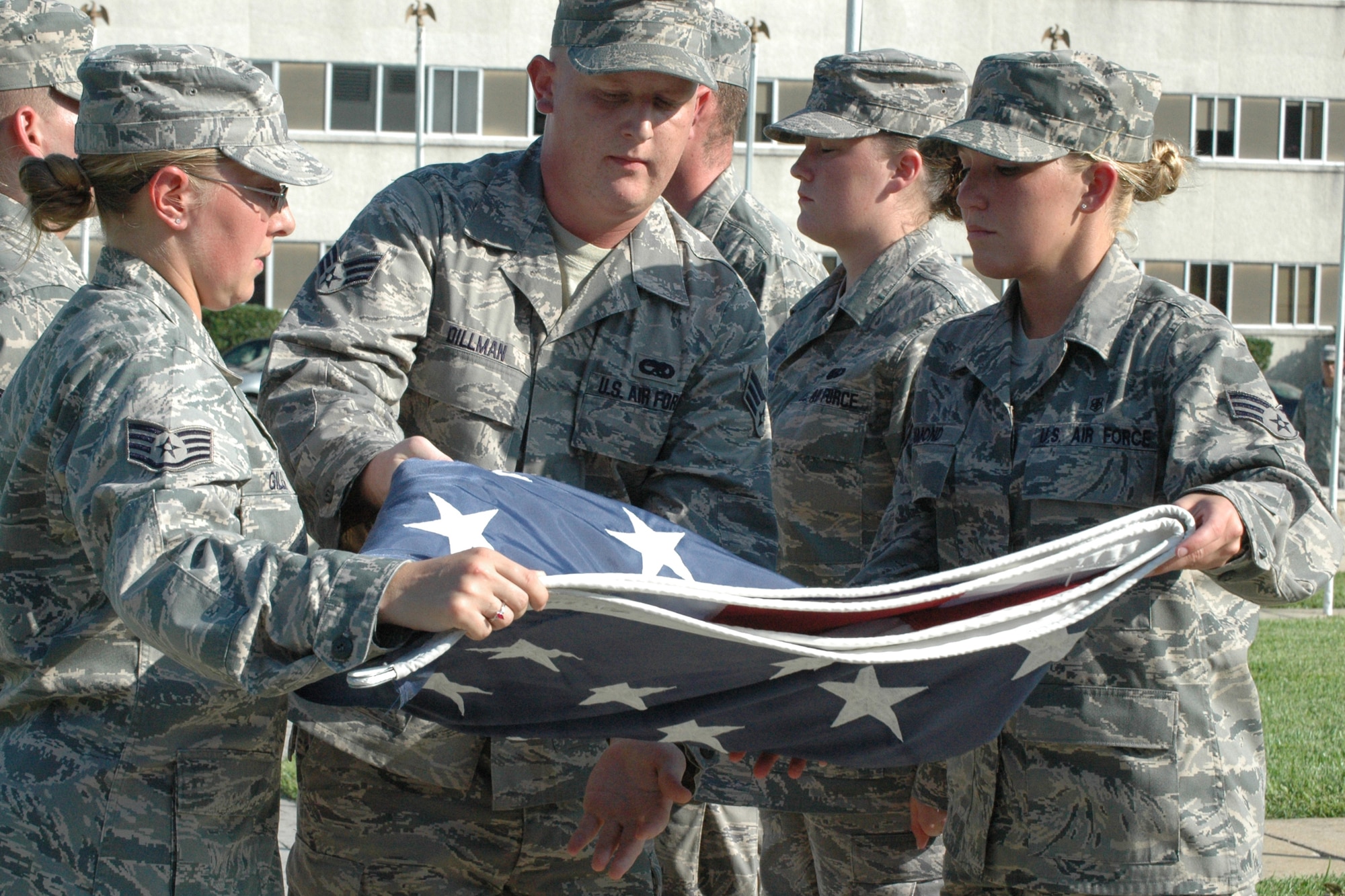 EGLIN AIR FORCE BASE, Fla. -- A flag detail, during retreat, meticulously folds the flag 13 times as part of a time honored tradition. Each fold symbolizes an American value or heritage. (US Air Force Photo/ Airman 1st Class Anthony Jennings)