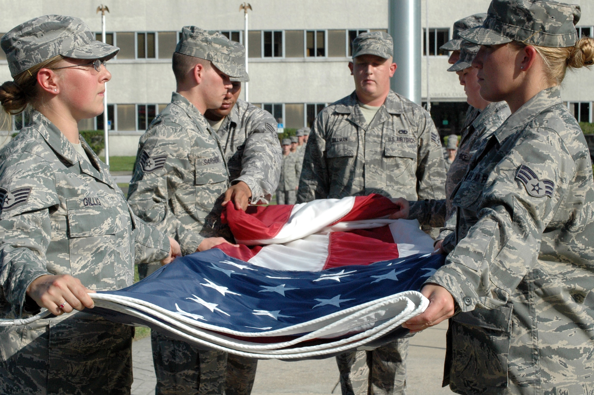 EGLIN AIR FORCE BASE, Fla. -- A flag detail meticulously folds the American flag 13 times during a retreat ceremony. Each fold in the flag symbolizes an American value and heritage. (US Air Force Photo/ Airman 1st Class Anthony Jennings)