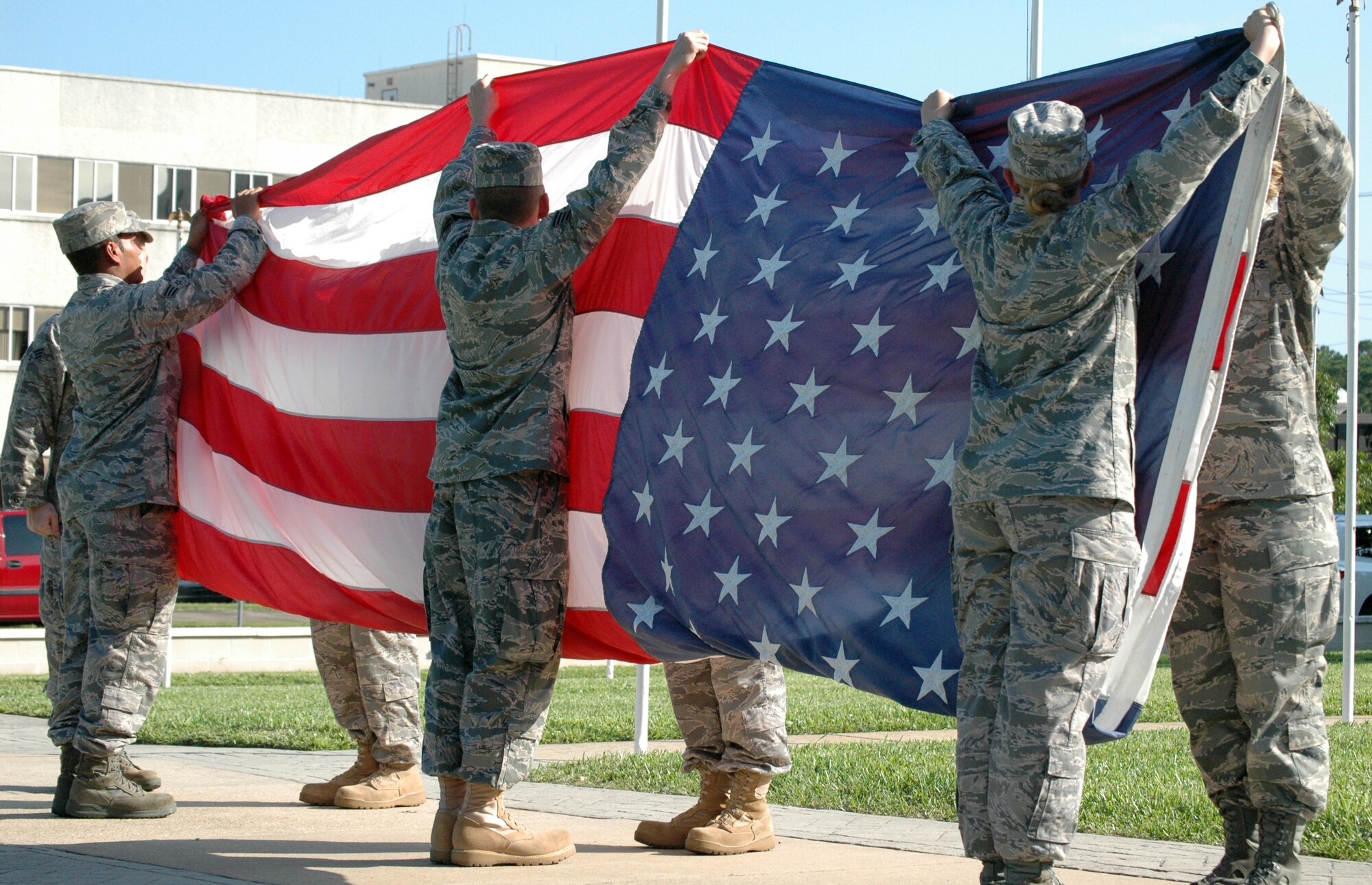 EGLIN AIR FORCE BASE, Fla. -- A flag detail meticulously folds the American flag 13 times during a retreat ceremony. Each fold in the flag symbolizes an American value and heritage. (US Air Force Photo/ Airman 1st Class Anthony Jennings)