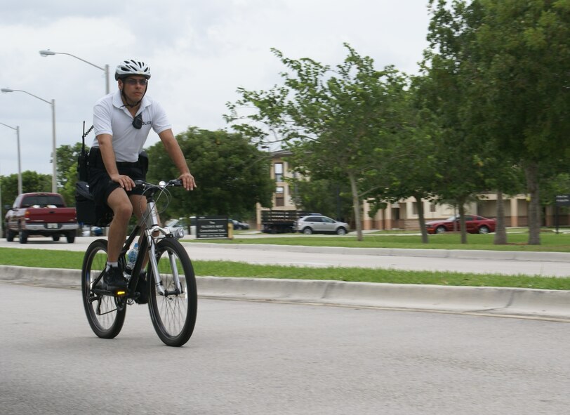 Tech. Rickie Cancel, 482nd Security Forces Squadron, patrols Homestead Air Reserve Base after the squadron received the green light to add a permanent bicycle patrol to complement existing vehicle patrols and security measures in place to safeguard base personnel and assets. The program was previously in a testing phase pending Air Force Reserve Command approval. And now that it’s official, funding requests will be submitted for two additional fully-equipped bikes and official attire. (U.S. Air Force photo/Staff Sgt. Erik Hofmeyer)