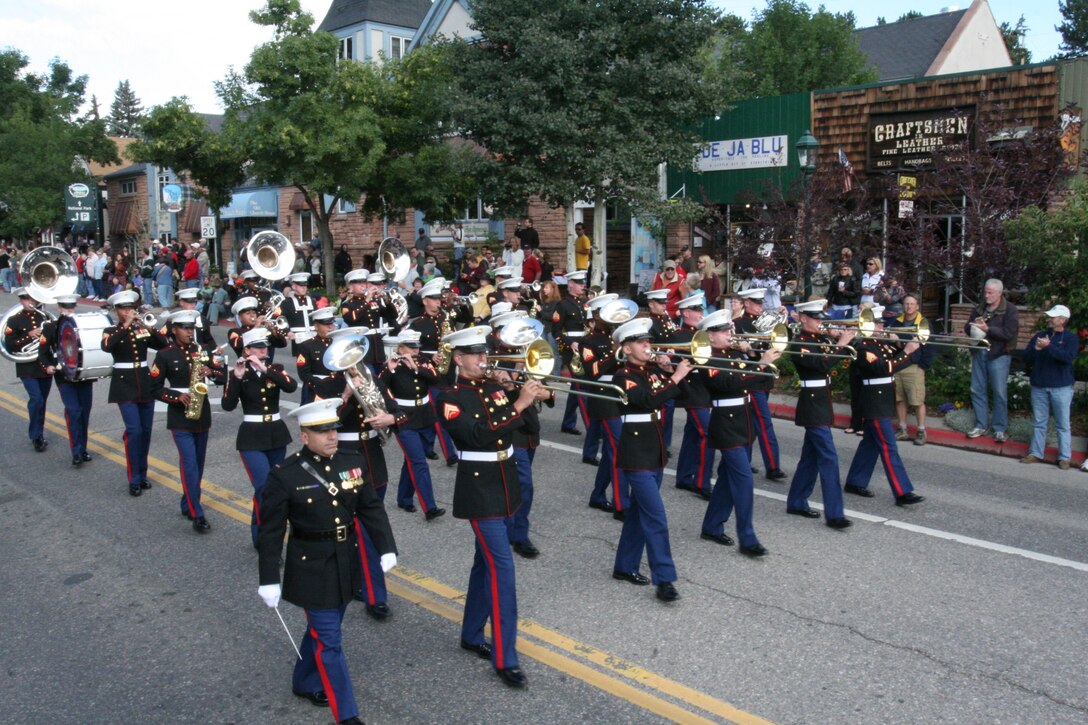 The Combat Center Band march in formation down Elkhorn Ave. Sept. 6 in Estes Park, Colo., during the town’s annual Long’s Peak Scottish-Irish Highland Festival Parade.  Fans braved chilly nights, with the help of hot chocolate and hot dogs, to see the bands’ quick and crisp marches and hear their defined sound, which makes them a fan favorite where-ever they go.  While some may think the band is merely an act for the ears and eyes, fans in attendance admitted the band also served as a unique means of boosting their morale and patriotism.  The festival, which celebrates Celtic traditions, featured Celtic music concerts, jousting competitions, Scottish athletic events, dancing competitions, vendors, and a dog exhibition competition, among other things.