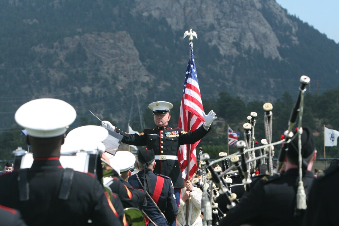 Gunnery Sgt. Richard A. Nunley, enlisted conductor with the Combat Center Band, leads the band during a performance Sept. 6 at the Stanley Park Fairgrounds in Estes Park, Colo., during the town’s annual Long’s Peak Scottish-Irish Highland Festival Parade.  Fans braved chilly nights, with the help of hot chocolate and hot dogs, to see the bands’ quick and crisp marches and hear their defined sound, which makes them a fan favorite where-ever they go.  While some may think the band is merely an act for the ears and eyes, fans in attendance admitted the band also served as a unique means of boosting their morale and patriotism.  The festival, which celebrates Celtic traditions, featured Celtic music concerts, jousting competitions, Scottish athletic events, dancing competitions, vendors, and a dog exhibition competition, among other things.