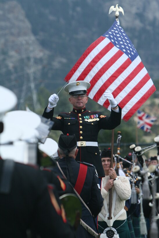 Gunnery Sgt. Richard A. Nunley, enlisted conductor with the Combat Center Band, leads the band during a performance Sept. 6 at the Stanley Park Fairgrounds in Estes Park, Colo., during the town’s annual Long’s Peak Scottish-Irish Highland Festival Parade.  Fans braved chilly nights, with the help of hot chocolate and hot dogs, to see the bands’ quick and crisp marches and hear their defined sound, which makes them a fan favorite where-ever they go.  While some may think the band is merely an act for the ears and eyes, fans in attendance admitted the band also served as a unique means of boosting their morale and patriotism.  The festival, which celebrates Celtic traditions, featured Celtic music concerts, jousting competitions, Scottish athletic events, dancing competitions, vendors, and a dog exhibition competition, among other things.
