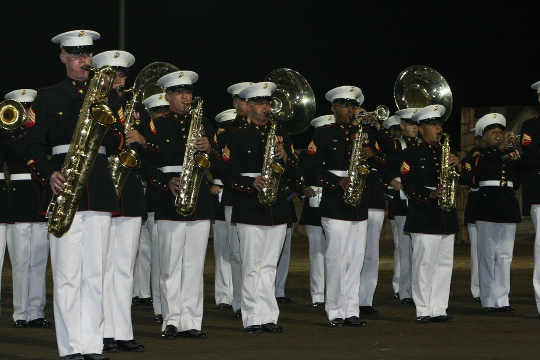Members of the Combat Center Band perform on the night of Sept. 6 in Estes Park, Colo., during the town’s annual Long’s Peak Scottish-Irish Highland Festival. ::r::::n:: Fans braved chilly nights, with the help of hot chocolate and hot dogs, to see the bands’ quick and crisp marches and hear their defined sound, which makes them a fan favorite where-ever they go.  While some may think the band is merely an act for the ears and eyes, fans in attendance admitted the band also served as a unique means of boosting their morale and patriotism.  The festival, which celebrates Celtic traditions, featured Celtic music concerts, jousting competitions, Scottish athletic events, dancing competitions, vendors, and a dog exhibition competition, among other things.