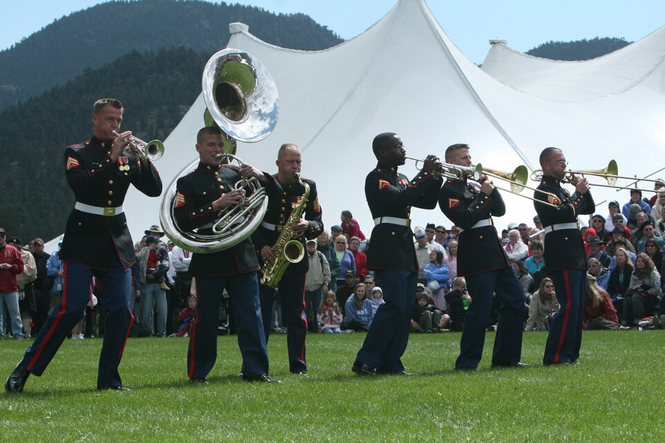 Sgt Victor L. Norris, tenor saxophonist, performs a solo while playing with the Combat Center’s Party Band Ensemble Sept. 7 in Estes Park, Colo., at the town’s annual Long’s Peak Scottish-Irish Highland Festival.  Warrant Officer 2 Stephen B. Giove, Combat Center band officer, said party bands, which resemble the famous brass bands of New Orleans, have always been incorporated into bands throughout the Marine Corps, and are meant to show fans that Marines are human while also providing those same fans with a good time.