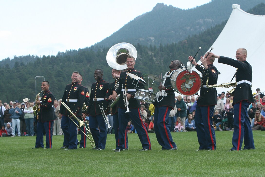 Members of the Combat Center’s Party Band Ensemble wave and address their fans Sept. 6 after a performance in Estes Park, Colo., at the town’s annual Long’s Peak Scottish-Irish Highland Festival.  Warrant Officer 2 Stephen B. Giove, Combat Center band officer, said party bands, which resemble the famous brass bands of New Orleans, have always been incorporated into bands throughout the Marine Corps, and are meant to show fans that Marines are human while also providing those same fans with a good time.