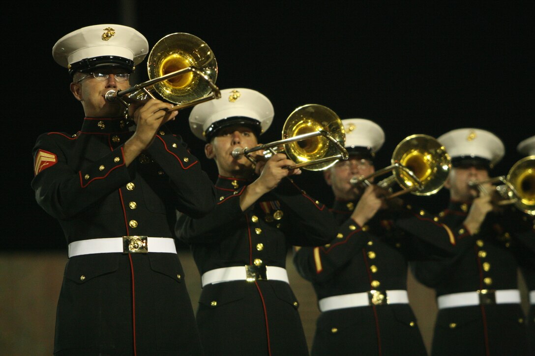 Trombone players with the Combat Center Band perform on the night of Sept. 6 in Estes Park, Colo., during the town’s annual Long’s Peak Scottish-Irish Highland Festival.  Fans braved chilly nights, with the help of hot chocolate and hot dogs, to see the bands’ quick and crisp marches and hear their defined sound, which makes them a fan favorite where-ever they go.  While some may think the band is merely an act for the ears and eyes, fans in attendance admitted the band also served as a unique means of boosting their morale and patriotism.  The festival, which celebrates Celtic traditions, featured Celtic music concerts, jousting competitions, Scottish athletic events, dancing competitions, vendors, and a dog exhibition competition, among other things.