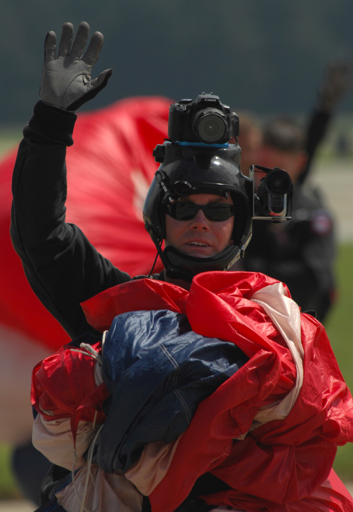 SHAW AIR FORCE BASE, S.C. -- Soliders from the 82nd Airborne Parachute Team wave to the crowd after landing on the flightline Sept. 6. ShawFest is a way for the military to show their thanks to Sumter and local communities for their continuous support. (U.S. Air Force photo/Staff Sgt. Patrick Mitchell)