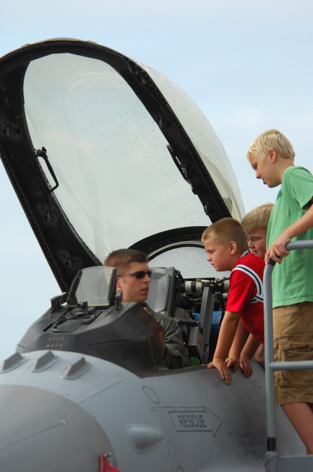 SHAW AIR FORCE BASE, S.C. -- First Lt. Matthew Strongin, 79th Fighter Squadron F-16 pilot, speaks to children about the capabilities of the F-16 Fighting Falcon aircraft during the ShawFest air show Sept. 6. ShawFest is a tribute of appreciation to the Sumter and local communities for their support of the military personnel of Shaw. (U.S. Air Force photo/Senior Airman Matthew Davis)