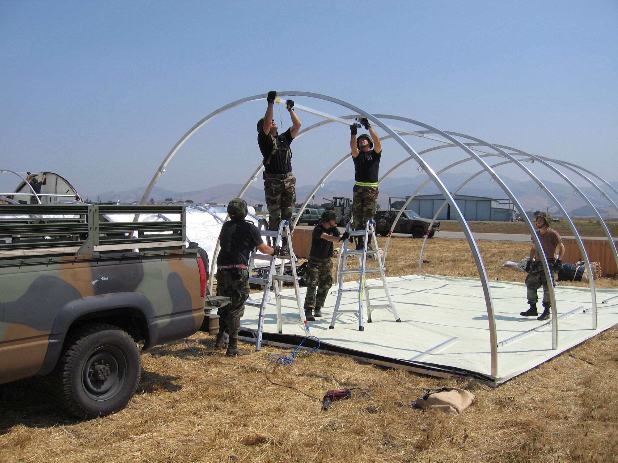 Members of the Kentucky Air Guard’s 123rd Contingency Response Group erect shelters during a deployment to California in July as part of an exercise to test the Air Force’s emergency airlift and reaction capabilities.