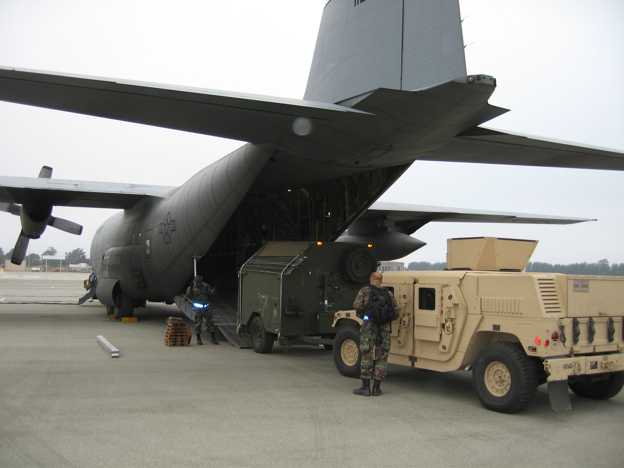 Members of the Kentucky Air Guard’s 123rd Contingency Response Group off-load equipment during a deployment to California in July as part of an exercise to test the Air Force’s emergency airlift and reaction capabilities. (Photo by Army Col. Phil Miller/KyArNG)