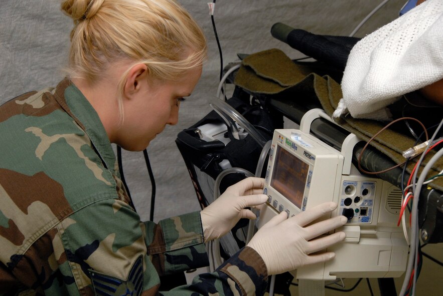 Staff Sgt. Tessa Burmania, aerospace nursing craftsman from the 115th Fighter Wing in Madison, WI monitors a patient’s vital signs in the recovery ward of an Emergency Medical Support (EMEDS) hospital during an EMEDS training deployment to the Air National Guard Combat Readiness Training Center in Alpena, MI on Aug. 27, 2008.  The week long training exercise tasked medical personnel from multiple Air National Guard units to work together to provide emergency medical relief to victims of a simulated earthquake. (US Air Force photo by Master Sgt. Paul Gorman) (RELEASED)