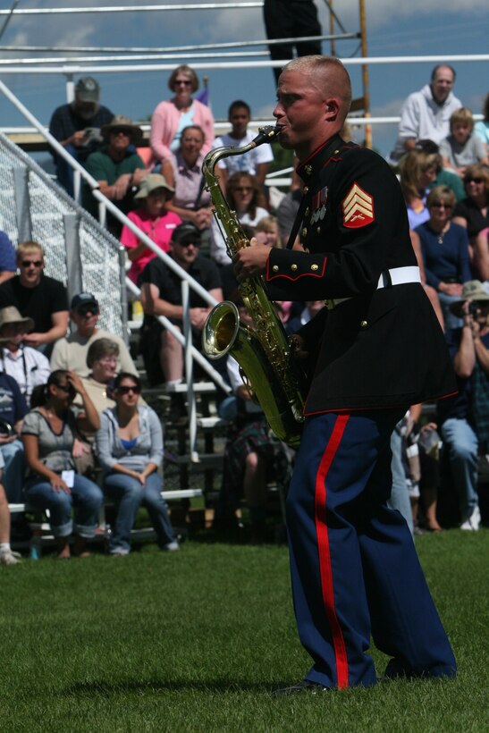 Sgt Victor L. Norris, tenor saxophonist, performs a solo while playing with the Combat Center’s Party Band Ensemble Sept. 7 in Estes Park, Colo., at the town’s annual Long’s Peak Scottish-Irish Highland Festival.  Warrant Officer 2 Stephen B. Giove, Combat Center band officer, said party bands, which resemble the famous brass bands of New Orleans, have always been incorporated into bands throughout the Marine Corps, and are meant to show fans that Marines are human while also providing those same fans with a good time.