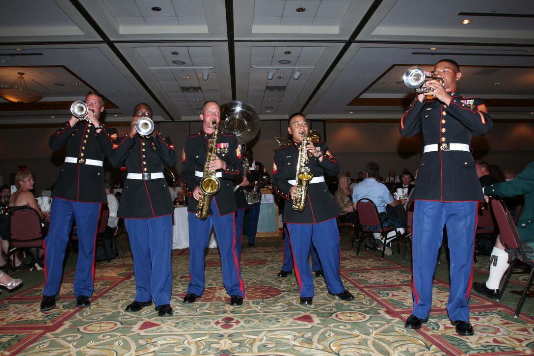 Members of the Combat Center’s Party Band Ensemble entertain fans Sept. 7 night at the Holiday Inn in Estes Park, Colo., at the town’s annual Long’s Peak Scottish-Irish Highland Festival Banquet.  Warrant Officer 2 Stephen B. Giove, Combat Center band officer, said party bands, which resemble the famous brass bands of New Orleans, have always been incorporated into bands throughout the Marine Corps, and are meant to show fans that Marines are human while also providing those same fans with a good time.