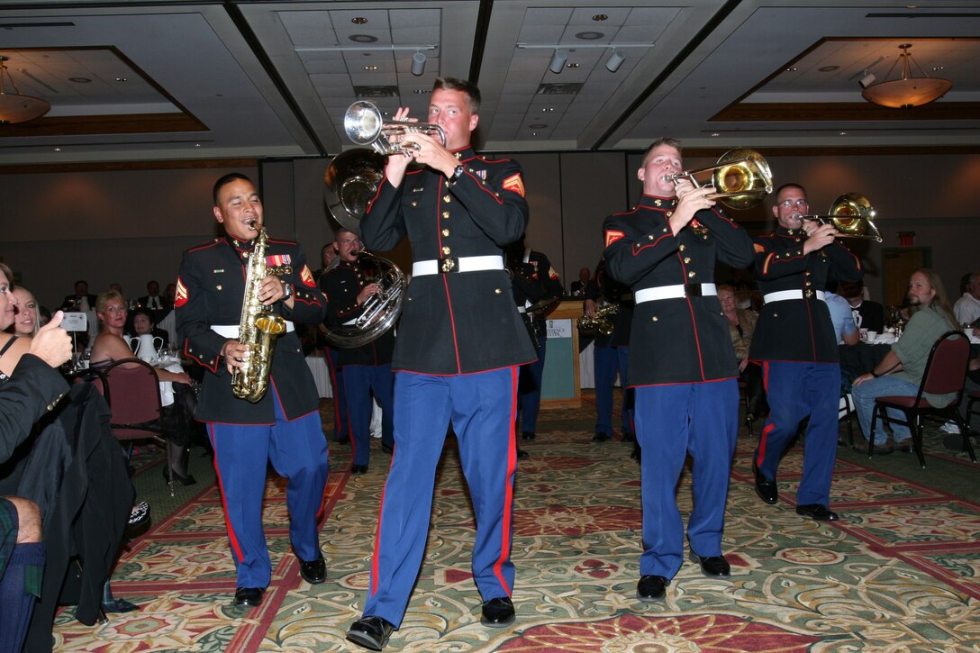 Members of the Combat Center’s Party Band Ensemble entertain fans Sept. 7 night at the Holiday Inn in Estes Park, Colo., at the town’s annual Long’s Peak Scottish-Irish Highland Festival Banquet.  Warrant Officer 2 Stephen B. Giove, Combat Center band officer, said party bands, which resemble the famous brass bands of New Orleans, have always been incorporated into bands throughout the Marine Corps, and are meant to show fans that Marines are human while also providing those same fans with a good time.