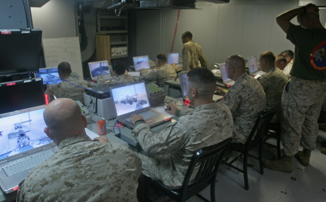 Marines and sailors with the 26th Marine Expeditionary Unit lead virtual convoys aboard USS San Antonio as part of a vehicle commander course during the MEU's trans-Atlantic crossing.