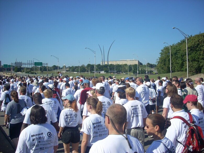 With the spires of the Air Force Memorial in the distance, participants in the Fourth Annual America Supports You  Freedom Walk Sept. 7, near the end of the 1-mile course at the Pentagon. This event is one of 330 such events designed to remember the Sept. 11, 2001, terrorist attacks on the United States. 
(U.S. Air Force photo/Senior Master Sgt. Matt Proietti)