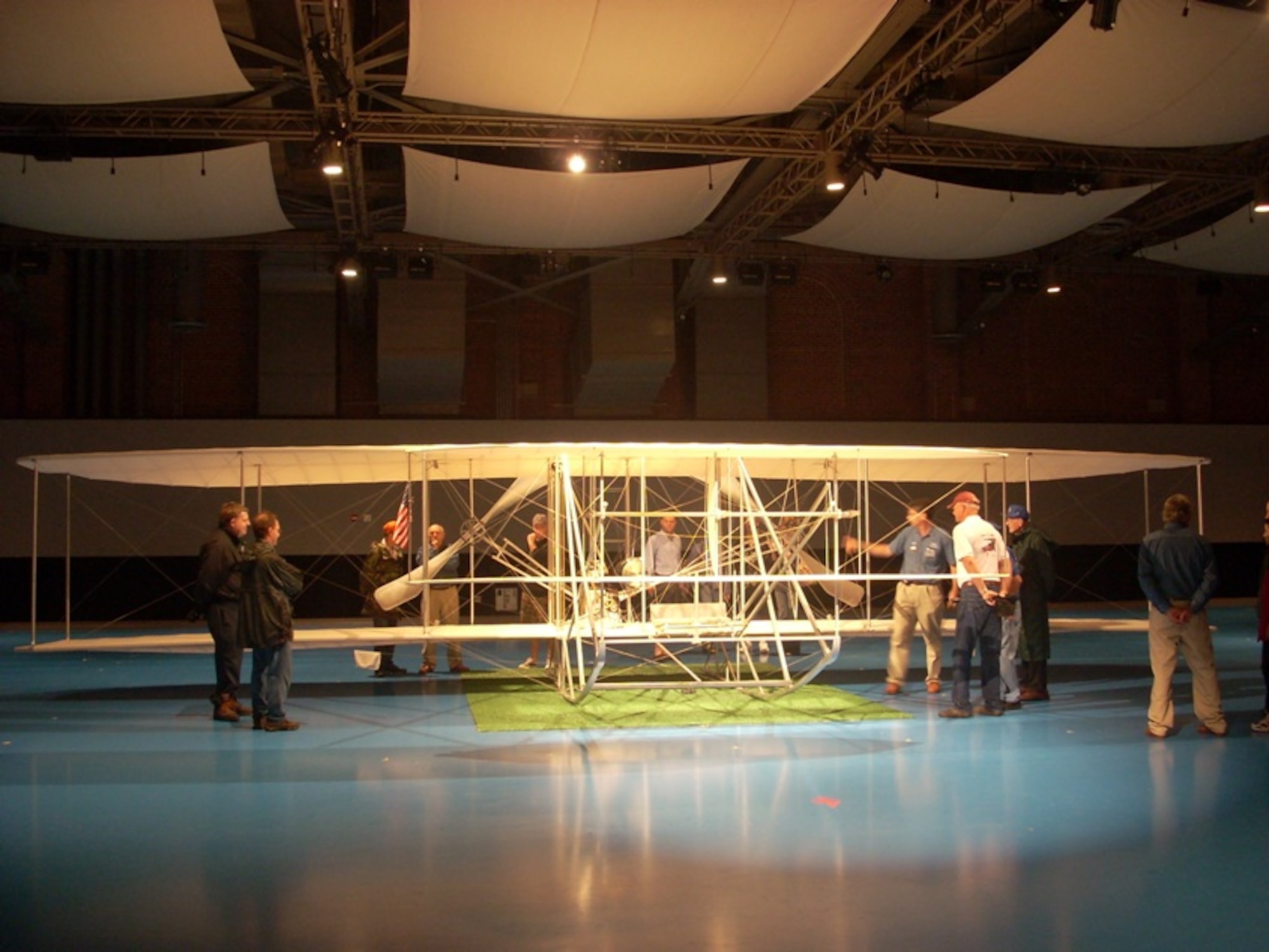 Visitors inspect a reproduction of the 1908 Wright aircraft Sept. 6, at Fort Myer, Va., during a Centennial of Military Aviation celebration. (U.S. Air Force photo/Senior Master Sgt. Matt Proietti)
