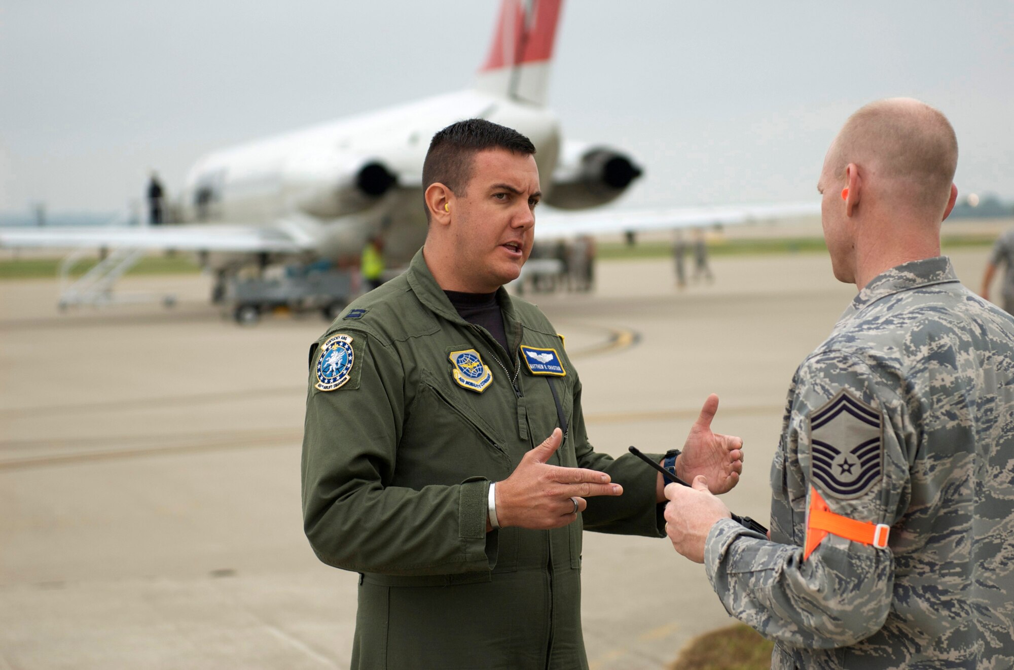 Capt. Matt Chastain of the Kentucky Air Guard's 165th Airlift Squadron discusses the Sept. 6 airflow plan for New Orleans-bound flights with Senior Master Sgt. Scott Andrews of the 123rd Logisitcs Readiness Squadron. (Photo by Capt. Dale Greer, Kentucky Air National Guard.)