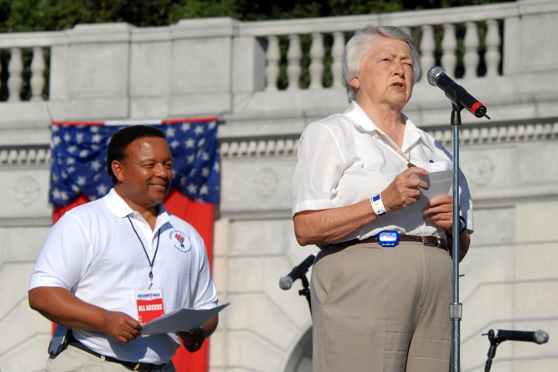 Retired Air Force Brig. Gen. Wilma L. Vaught, president of the Women in Military Service for America Memorial Foundation, speaks during the start of the 2008 National America Supports You Freedom walk at the foundation's memorial at Arlington National Cemetery, Va., Sept. 7, 2008. Kelly Wright, left, co-anchor of Fox & Friends Weekend, served as the event's master of ceremonies.