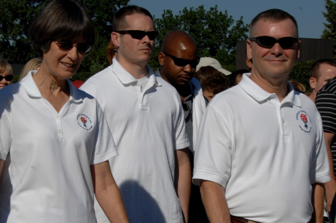 Vice Chairman of the Joint Chiefs of Staff U.S. Marine Gen. James E. Cartwright, front right, and his wife, Sandee, walk during the America Supports You Freedom Walk in Washington, D.C., Sept. 7, 2008. Thousands of walkers joined in the national walk, which went from the Women in Military Service for America Memorial at Arlington National Cemetery to the crash site at the Pentagon. 
