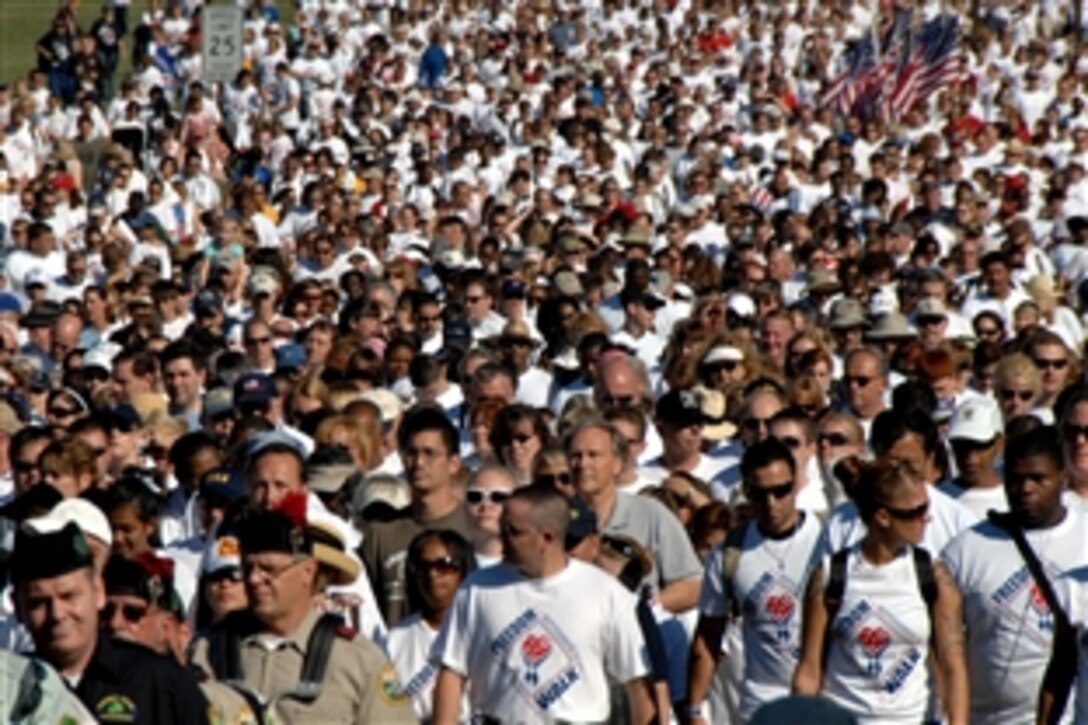 Thousands of people walk during the 2008 America Supports You Freedom Walk in Washington, D.C., Sept. 7, 2008. The walk went from the Women in Military Service for America Memorial at Arlington National Cemetery to the crash site at the Pentagon. 