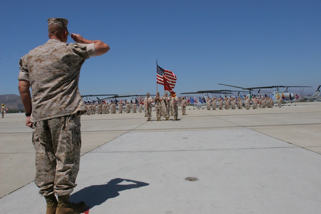 Lt. Col. Robert F. Jablonski, commanding officer, Marine Light Attack Helicopter Squadron 775, salutes during the final March on the Colors during the deactivation ceremony of the squadron, Sept. 6.