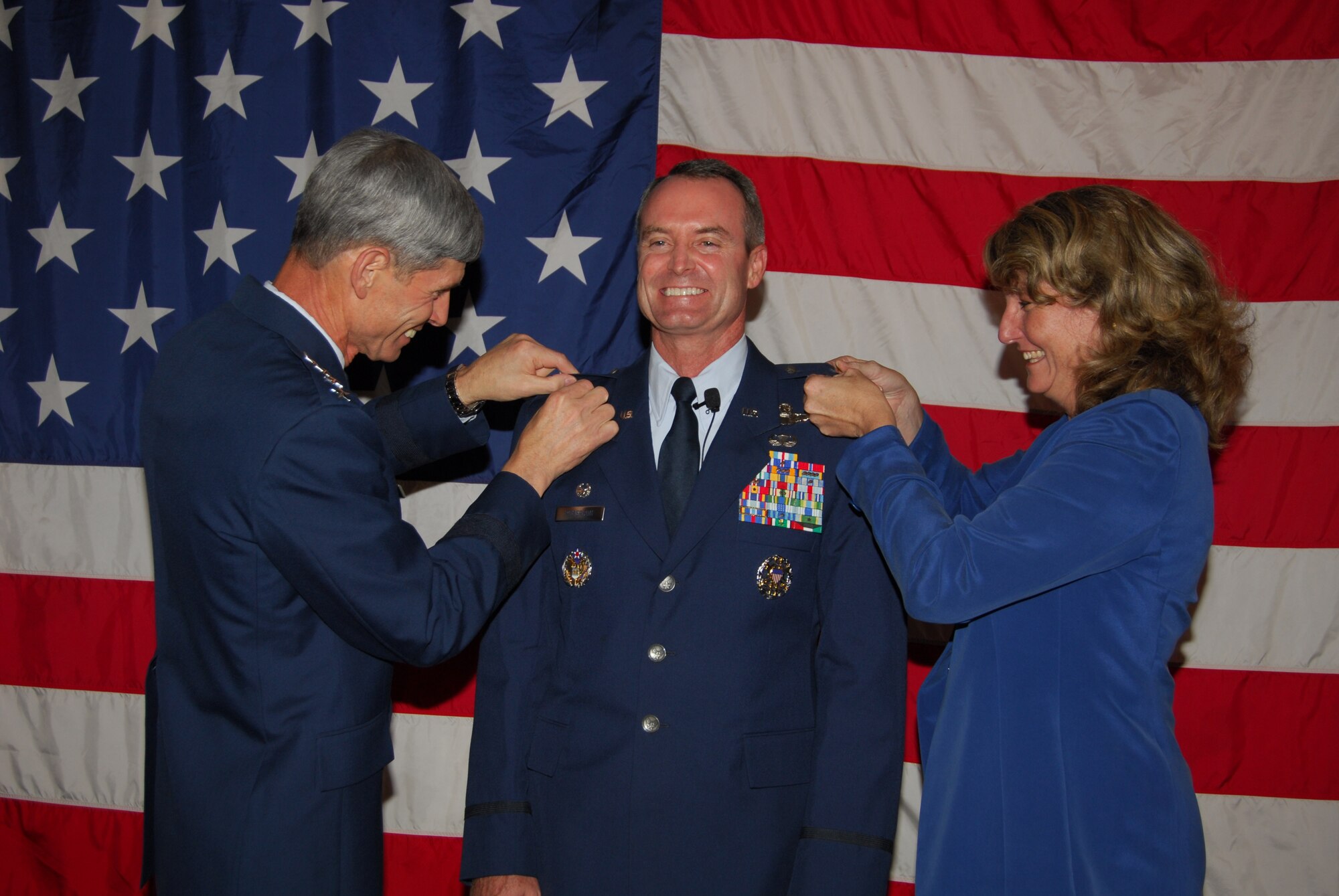 U.S. Air Force Chief of Staff Gen. Norton A. Schwartz and Mrs. Cheryl Roberson, wife of 325th Fighter Wing commander, pin one-star insignia on newly minted general officer Brig. Gen. Darryl Roberson.  (U.S. Air Force photo by Lisa Norman)
